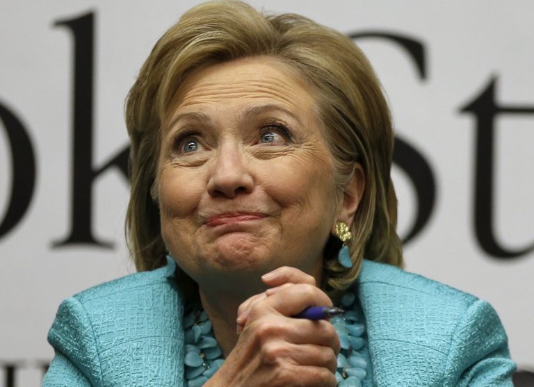 Former Secretary of State Hillary Rodham Clinton reacting to a customer at a signing for her new book 