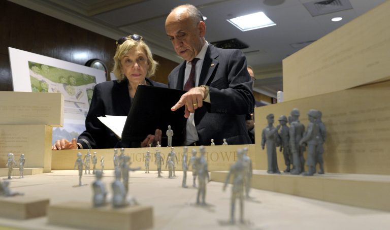 Daniel J. Feil, executive architect of the Eisenhower Memorial Commission, right, talks with Susan Banes Harris, who chairs the Commission's architecture committee, as they look over architect Frank Gehry's model of the Eisenhower Memorial before a meeting of the Eisenhower Memorial Commission on Capitol Hill in Washington, Tuesday, May 15, 2012. (AP Photo/Susan Walsh)