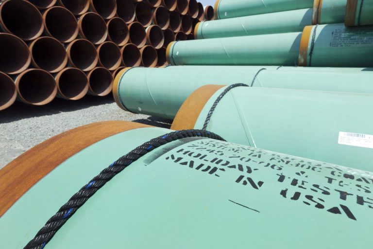 Some of about 500 miles worth of coated steel pipe manufactured by Welspun Pipes, Inc., originally for the Keystone oil pipeline, is stored in Little Rock, Ark. (AP/Danny Johnston)