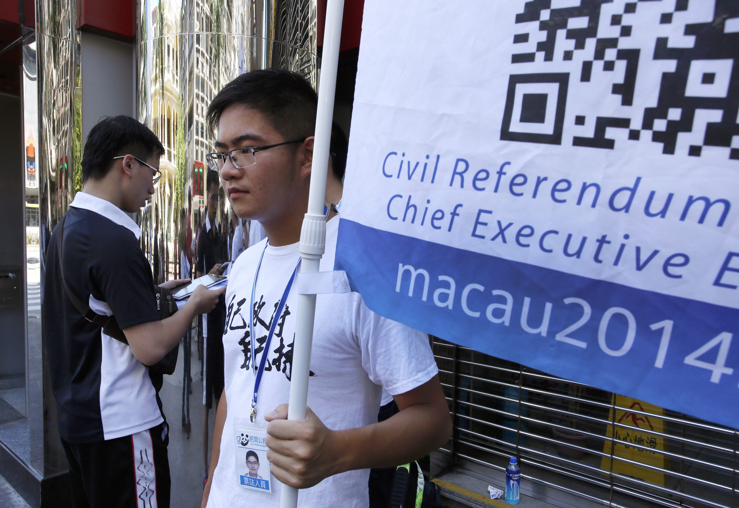 Macau police arrest 5 over informal democracy poll
