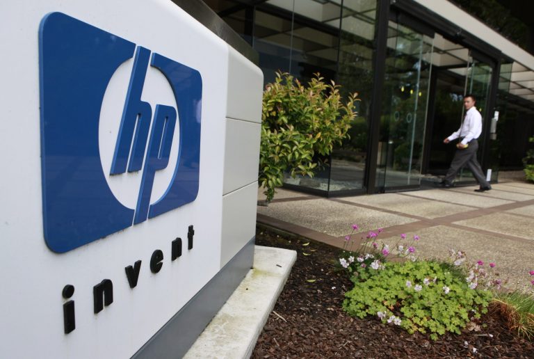 A worker arrives at Hewlett-Packard Co. headquarters in Palo Alto, Calif., in June 2010. (AP Photo/Paul Sakuma, file)