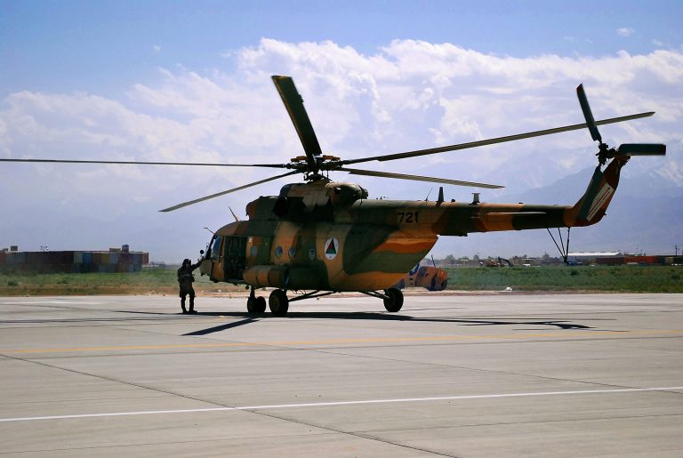 FILE - This May 13, 2013 file photo shows a Mi-17 helicopter, used by the Afghan Air Force sitting on Bagram Air Field in Afghanistan. Sen. John Cornyn, R-Texas says the Defense Department is canceling plans to buy additional cargo helicopters from the Russian arms export agency that is a top supplier of weapons to Syria's military forces. The additional 15 Mi-17s were to be purchased next year at a cost of $345 million and then delivered to Afghanistan's national security forces. (AP Photo/Kristin M. Hall, File)