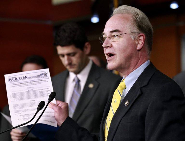 House Budget Committee member Rep. Tom Price, R-Ga., right, accompanied by committee Chairman Paul Ryan, R-Wis., left, and other committee members, speaks during a news conference on Capitol Hill in Washington, Wednesday, Dec. 7, 2011, to unveil a 