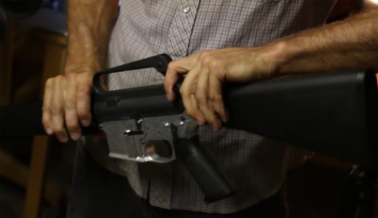 In this screenshot from Defense Distributed's YouTube channel, a firearm made by the Ghost Gunner auto-milling machine is displayed. Defense Distributed's founder, Cody Wilson, says sales doubled in February after the Valentine's Day massacre at a Florida high school, where 19-year-old Nikolas Cruz stands accused of murdering 17 people with an AR-15. (Screenshot)