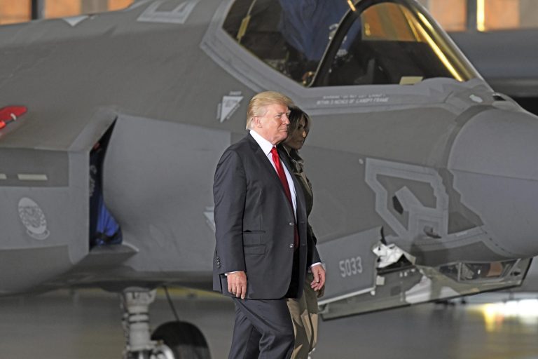 President Trump and first lady Melania Trump walk in front of an F-35 Joint Strike Fighter as they arrive to deliver remarks to military personnel at Joint Base Andrews in Maryland on Sept. 15. The F-35 is a plane the President has criticized in the past. (Ron Sachs/picture-alliance/dpa/AP Images)