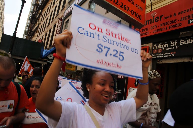 Employees and supporters demonstrate outside of a Wendy's and Burger King fast-food restaurants to demand higher pay and the right to form a union on August 29, 2013 in New York City. (Photo by Spencer Platt/Getty Images)