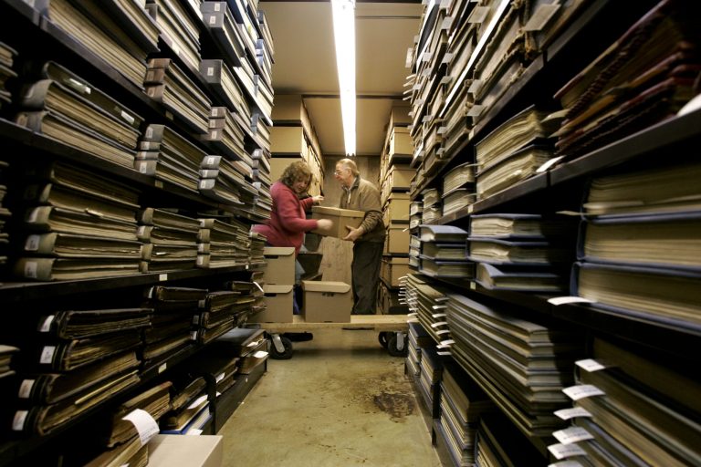 Archivists place boxes of official and personal records, including 500 gigabytes of email and other electronic files, on the shelves in archive stacks.Â During the seven days of Sunshine Week media outlets, nonprofits, schools and concerned citizens team up to promote the importance of transparency and accountability at all levels of government.Â (AP Photo/Kiichiro Sato)