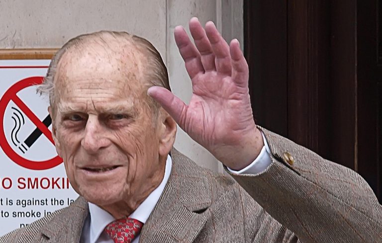   Prince Philip, Duke of Edinburgh waves as he leaves King Edward VII Hospital in central London after being treated for a bladder infection, Saturday, June 9, 2012. The duke will celebrate his 91st birthday Sunday privately with members of the family. On Friday he enjoyed the company of grandsons the Duke of Cambridge and Prince Harry who paid a short, private visit to the hospital. (AP Photo/PA, Max Nash) UNITED KINGDOM OUT NO SALES NO ARCHIVE  