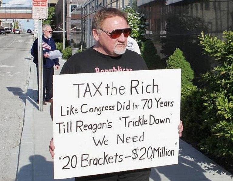 In this undated file photo, James Hodgkinson, the suspect in Wednesday's shooting at a baseball practice for GOP lawmakers in Virginia, holds a sign during a protest outside a United States Post Office in Belleville, Ill. (Derik Holtmann/Belleville News-Democrat via AP)
