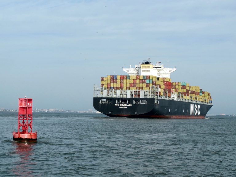 In this March 20, 2014 photo, a container ship makes its way into the Port of Charleston in Charleston, S.C. U.S. Rep. Tom Rice, R-S.C., said on Tuesday, May 20, 2014 that a new federal Water Resources bill will smooth the way for deepening the Charleston Harbor shipping channel and be a big boost for smaller ports like the Port of Georgetown, S.C.  The U.S. House approved the water bill conference report on Tuesday with the Senate to take up the measure later this week. (AP Photo/Bruce Smith)