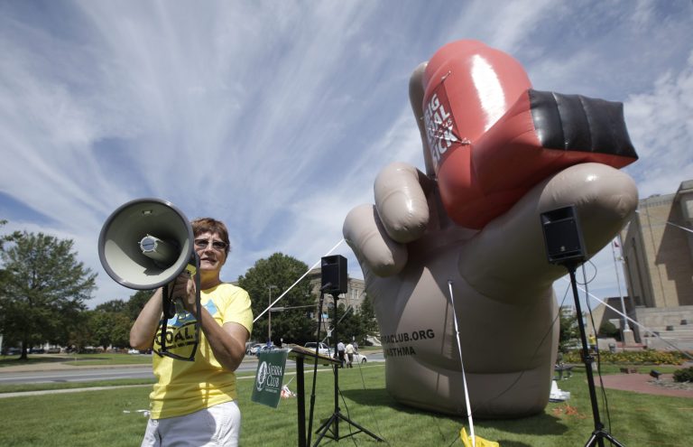 A Sierra Club volunteer Becky Williams uses a megaphone in Little Rock, Ark., at a rally against a coal-fired power plant near a large inflatable depicting a hand holding an asthma inhaler.Â Ozone is the primary component in smog and typically concentrates in high population areas. It particularly affects people with asthma, children and the elderly.Â Â (AP Photo/Danny Johnston, File)