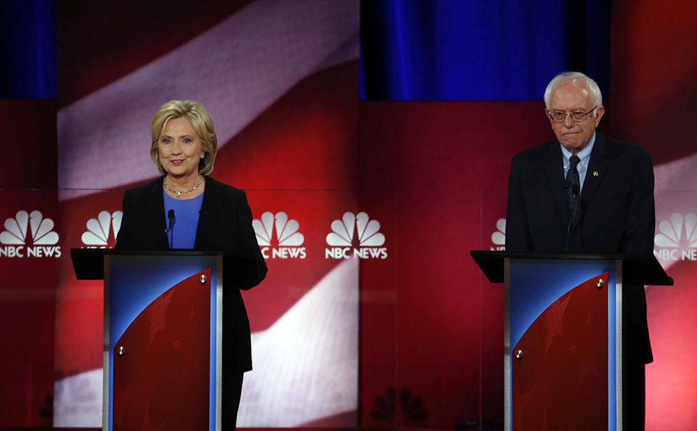 Clinton says Sanders would set back Obamacare