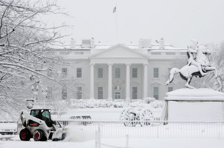 The Trump administration's Office of Personnel Management will decide by 4 a.m. Tuesday whether federal workers get a snow day on Tuesday. (AP Photo/Evan Vucci)