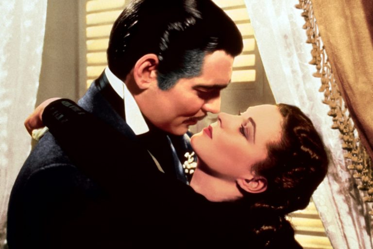 In this image provided by Turner Classic Movies, Clark Gable, left, appears in character as Rhett Butler and Vivien Leigh as Scarlett O'Hara, in the film 
