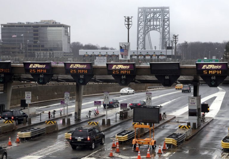 This Jan. 11, 2014, file photo shows traffic passing through the toll booths at the George Washington Bridge, in Fort Lee, N.J. A member of New Jersey Gov. Chris Christie's administration,who has been subpoenaed in an alleged political payback investigation involving the bridge, has resigned. (AP Photo/Richard Drew, File)