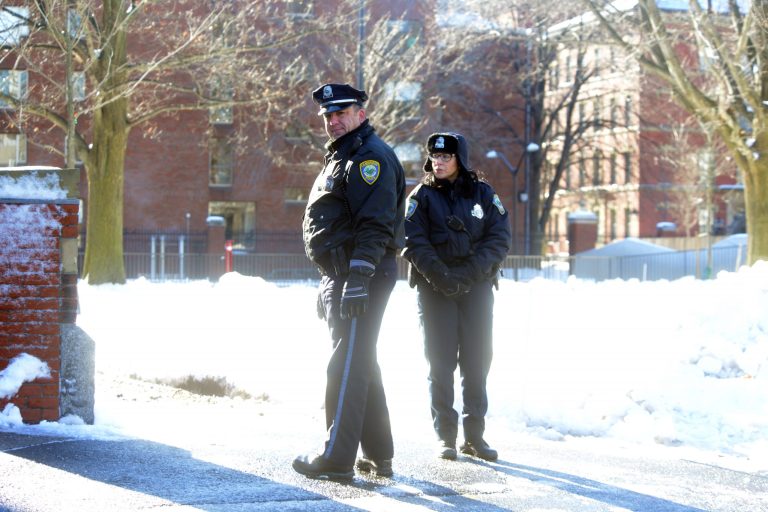Â A police officers stand outside the science building at Harvard University during a bomb scare December 16, 2013 in Cambridge, Massachusetts. Police were alerted at roughly nine thirty this morning of possible bombs at four different buildings on the Harvard campus. (Photo by Darren McCollester/Getty Images)