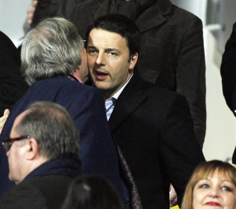 Democratic Party leader Matteo Renzi, a Fiorentina supporter, right, is greeted by Fiorentina owner Diego della Valle, as he arrives for a Serie A soccer match between Fiorentina and Inter Milan at the Artemio Franchi stadium in Florence, Italy, Saturday,  Feb. 15, 2014. Italy's President Giorgio Napolitano met with political leaders in Rome to try to determine if Renzi has enough support to form a new government after he sidelined outgoing Premier Enrico Letta, a rival Democrat. (AP Photo/Fabrizio Giovannozzi)