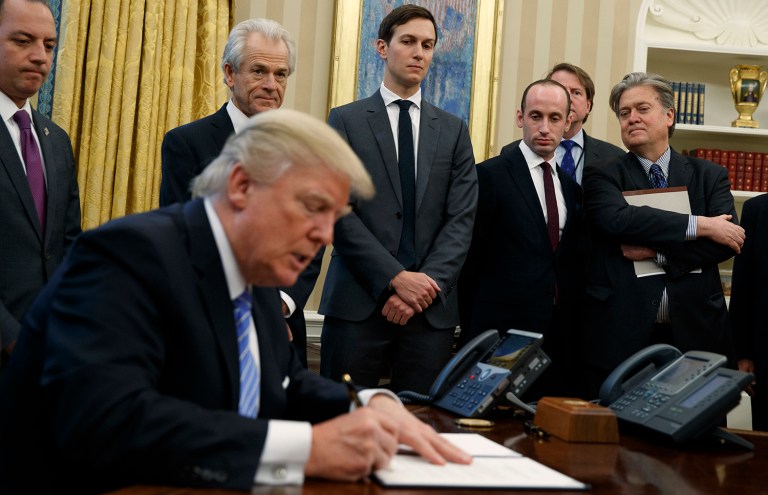 President Trump signs an executive order to reinstate the 