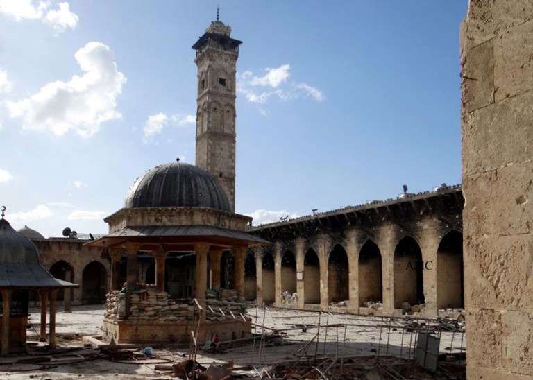 This March 6, 2013 citizen journalism image provided by Aleppo Media Center AMC which has been authenticated based on its contents and other AP reporting, shows the minaret of a famed 12th century Umayyad mosque before it was destroyed by the shelling, in the northern city of Aleppo, Syria. The minaret of a famed 12th century Sunni mosque in the northern Syrian city of Aleppo was destroyed Wednesday, April 24, 2013. President Bashar Assad's regime and anti-government activists traded blame for the attack against the Umayyad mosque, which occurred in the heart Aleppo's walled Old City, a UNESCO World Heritage site.(AP Photo/Aleppo Media Center, AMC)