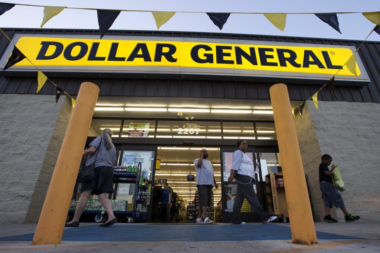 In this Wednesday, Sept. 25, 2013, file photo, customers exit a Dollar General store in San Antonio.