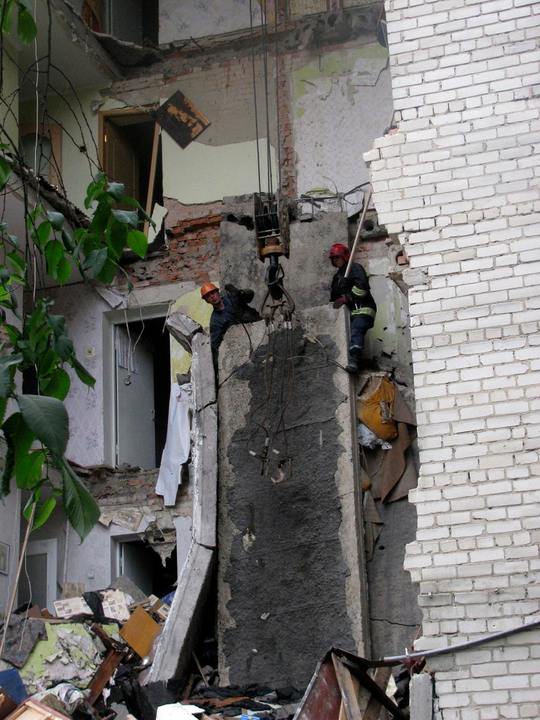   In this photo dated Sunday, June 10, 2012 released by Emergency Situations Ministry, Emergency Situations Ministry workers clear the site of collapsed building in Lutsk, Ukraine. Emergency officials say one person was killed and one injured when a vertical section in a five-story apartment building in western Ukraine collapsed. The incident took place in the early hours of Sunday in the western city of Lutsk, some 150 kilometers (90 miles) north of the city of Lviv, which co-hosts the European football championship this month, the Emergency Situations Ministry said. (AP Photo/Emergency Situations Ministry)  