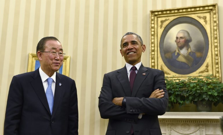 President Barack Obama stands up with United Nations Secretary-General Ban Ki-moon at the end of their meeting in the Oval Office at the White House in Washington, Tuesday, Aug. 4, 2015. (AP Photo/Susan Walsh)