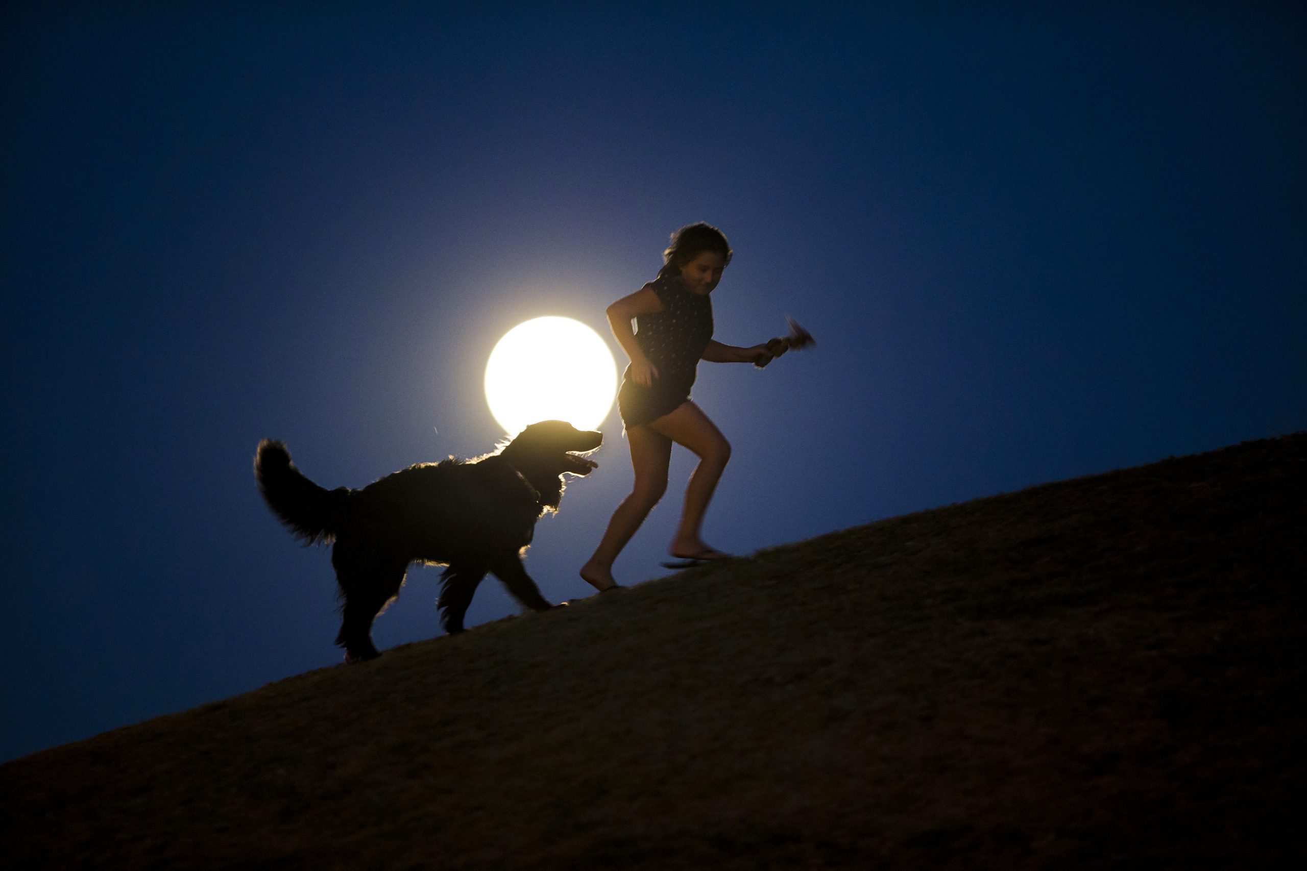 AP PHOTOS: Lunar show illuminates world’s skies