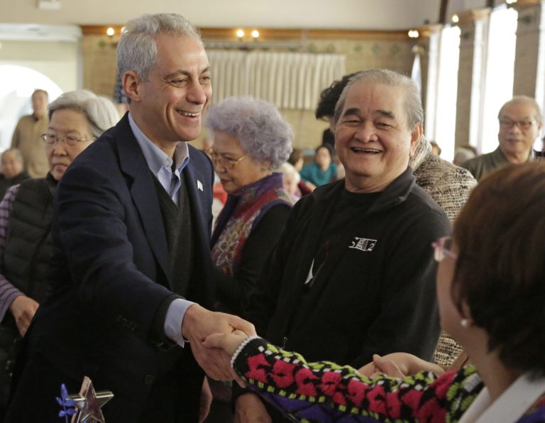 Chicago Mayor Rahm Emanuel shakes hands with voters at a campaign stop Monday, Feb. 23, 2015, in Chicago. (AP Photo/M. Spencer Green)