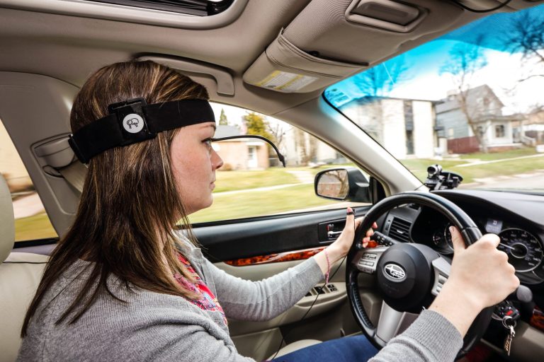 This March 6, 2014 image provided by AAA Foundation via DanCampbellPhotography.com shows a driver during the Cognitive Distraction Phase II testing in Salt Lake City. Two new studies have found that voice-activated smartphones and dashboard infotainment systems may be making the distracted-driving problem worse. (AP Photo/DanCampbellPhotographer.com via AAA Foundation)