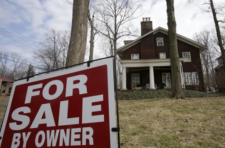 This Friday, March 21, 2014 shows a home for sale in Shaker Heights, Ohio. The National Association of Realtors reports on existing-home sales in March on Tuesday, April 22, 2014. (AP Photo/Tony Dejak)