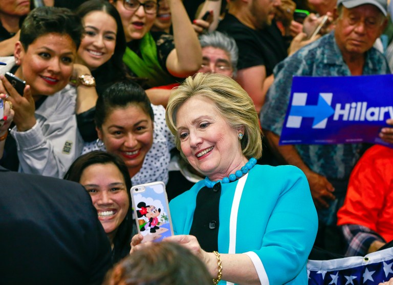 Priorities USA and People For the American Way will begin running radio ads in Nevada on Sept. 27, months after their first Spanish-language television ads went up in Virginia and Nevada. (AP Photo/Damian Dovarganes)