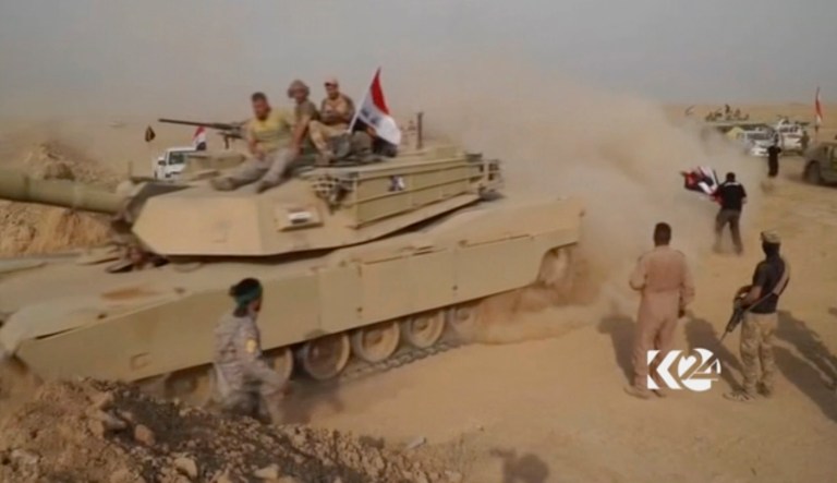An Iraqi tank moving into position as forces begun the operation to retake the town of Hawija, Iraq, from the Islamic State group. The top U.S. military commander in Iraq has congratulated Iraqi forces for their 