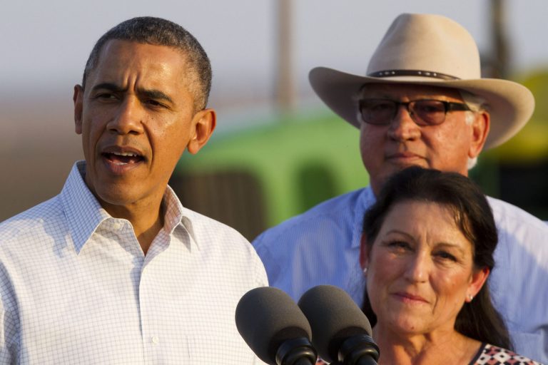 President Obama speaks about drought conditions on a local farm with Joe Del Bosque, right, and Maria Gloria Del Bosque, of Empresas Del Bosque, Inc., in Los Banos, Calif., on Friday. (AP Photo/Jacquelyn Martin)