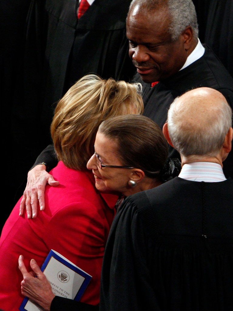 Associate Supreme Court Justice Ruth Bader Ginsburg gets a hug from Secretary of State Hillary Rodham Clinton prior to President Barack Obama's address to a joint session of Congress in the House Chamber of the Capitol in Washington, Tuesday, Feb. 24, 2009. (AP Photo/Charles Dharapak)