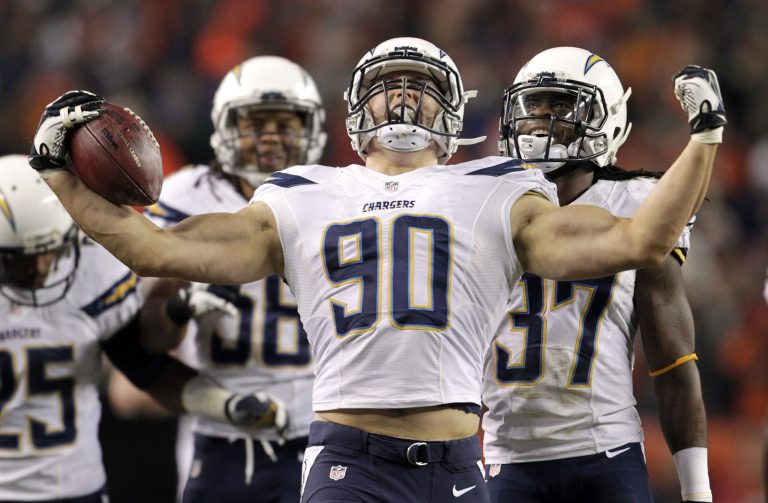 FILE - In this Thursday, Dec. 12, 2013, file photo, San Diego Chargers linebacker Thomas Keiser (90) celebrates after intercepting a pass by Denver Broncos quarterback Peyton Manning in the fourth quarter of an NFL football game in Denver. 