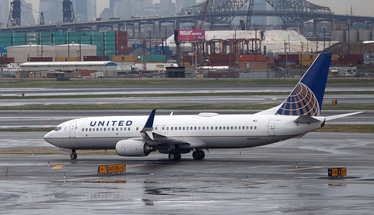 The airline has reached a settlement with the Kentucky doctor who was dragged off the plane. (AP Photo/Julio Cortez)