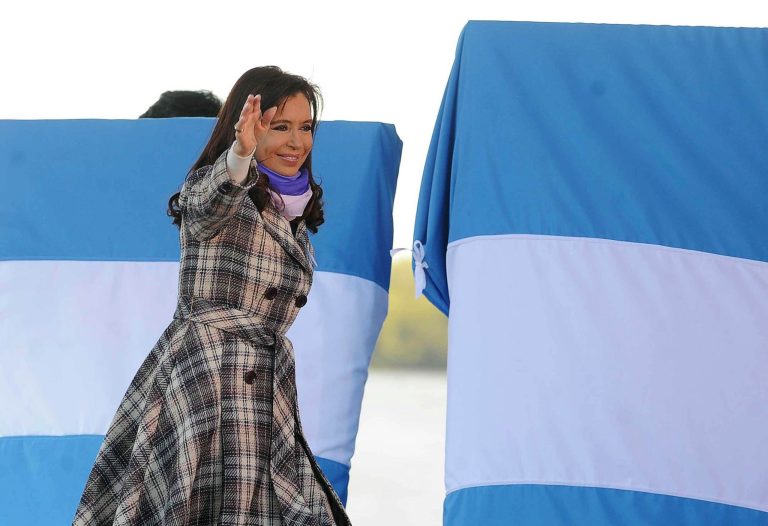 Argentina's President Cristina Fernandez waves as she arrives for a ceremony marking National Flag Day in Rosario, Argentina, Friday, June 20, 2014. Fernandez says she's sending lawyers to New York to seek fair terms for paying all the country's creditors, including the hedge funds that have refused to accept earlier debt restructurings. (AP Photo/Raul Ferrari, Telam)