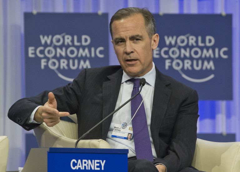 FILE - In this Saturday Jan. 25, 2014 file photo, Governor of the Bank England, Mark J. Carney, gestures as he speaks during a session at the World Economic Forum in Davos, Switzerland. The Bank of England is set to unveil a new policy framework after unemployment in Europe's third-largest economy has fallen far faster than anticipated. Its Canadian governor, Mark Carney, is expected to use the opportunity of the bank's quarterly projections on Wednesday Feb. 12, 2014 to update the guidance on the future path of monetary policy. (AP Photo/Michel Euler, File)