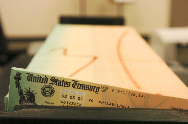 FILE - In this Feb. 11, 2005 file photo, trays of printed social security checks wait to be mailed from the U.S. Treasury's Financial Management services facility in Philadelphia.  For the second straight year, millions of Social Security recipients can expect an historically small increase in benefits come January 2014.  (AP Photo/Bradley C. Bower, File)