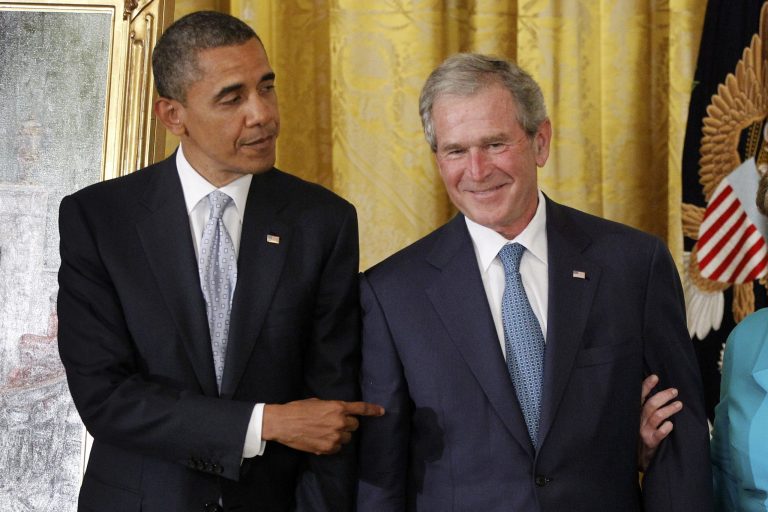 President Obama points to former President George W. Bush during a ceremony to unveil his official portrait. (AP Photo/Charles Dharapak)