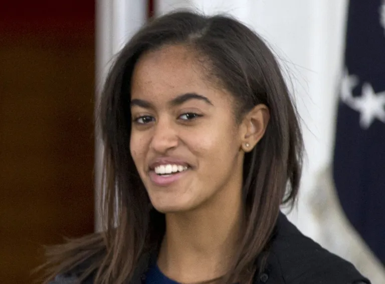 Obama reveals daughter Malia attended first prom