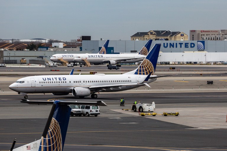 United airplanes sit outside the company's hangar at Newark Liberty International Airport. Investing giant Berkshire Hathaway owns stakes in that airline and its three biggest U.S. competitors with a combined value of $10.2 billion. (Timothy Fadek/Bloomberg)