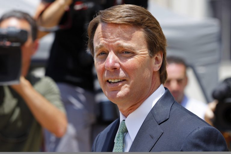 John Edwards leaves a federal courthouse during his trial on charges of campaign corruption in Greensboro, N.C., in 2012. (AP Photo/Chuck Burton)