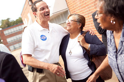 Anita Bonds shares a laugh with then-mayoral candidate Vincent Gray while visiting a voting station in NE in 2010. (Andrew Harnik/Examiner)