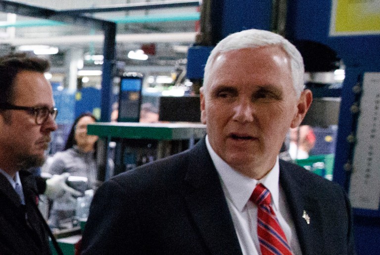 Pence praised Trump for brokering a deal with the air-conditioning company Carrier to keep 1,100 manufacturing jobs at the Indianapolis plant rather than moving them to Mexico. (AP Photo/Evan Vucci)