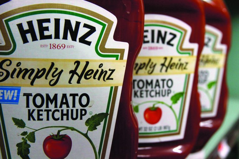 FILE - In this March 2, 2011 file photo, Heinz ketchup is seen on the shelf of a market in Barre, Vt. H.J. Heinz Co. says it agreed to be acquired by an investment consortium including billionaire investor Warren Buffett in a deal valued at $28 billion. (AP Photo/Toby Talbot, File)