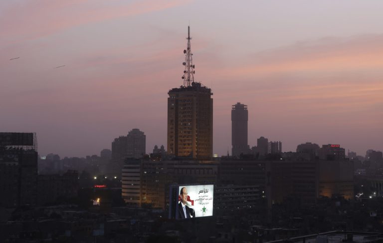 A billboard supporting presidential candidate Abdel-Fattah el-Sissi, the country's former military chief, is seen lighten in front of the television building in Cairo, Egypt, Saturday, May 24, 2014. Considered all but certain to win is el-Sissi, the man who removed the former president, Mohammed Morsi. El-Sissi, who for the past 10 months has been the most powerful figure in Egypt, faces one other candidate in the race, leftist politician Hamdeen Sabahi, who finished third in the 2012 presidential election. (AP Photo/Amr Nabil)