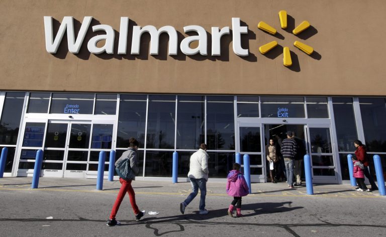 Customers walk into and out of Walmart in Methuen, Mass., Monday, Feb. 20, 2012. (AP Photo/Elise Amendola)