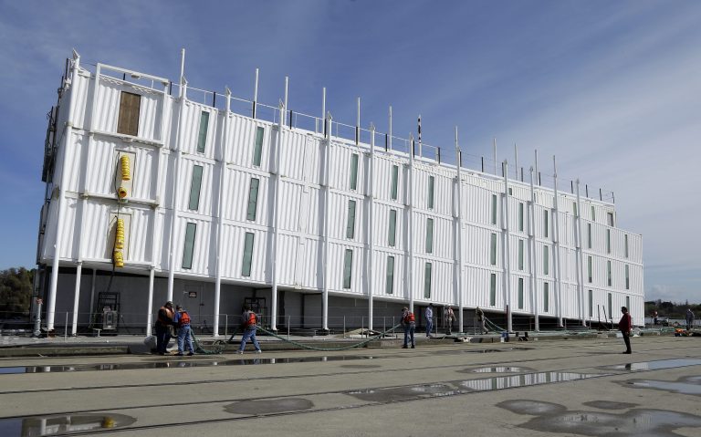The Google barge is seen moored at the Port of Stockton Thursday, March 6, 2014, in Stockton, Calif.  Google's mystery barge has arrived at its new home in the California delta after the Internet company was ordered to move it from San Francisco. The odd-looking, four-story vessel made of recycled shipping containers departed from Treasure Island to comply with a Jan. 31, regulatory order concluding that Google Inc. didn't have the proper permits to build it there. Construction stopped on the project late last year. (AP Photo/Ben Margot)