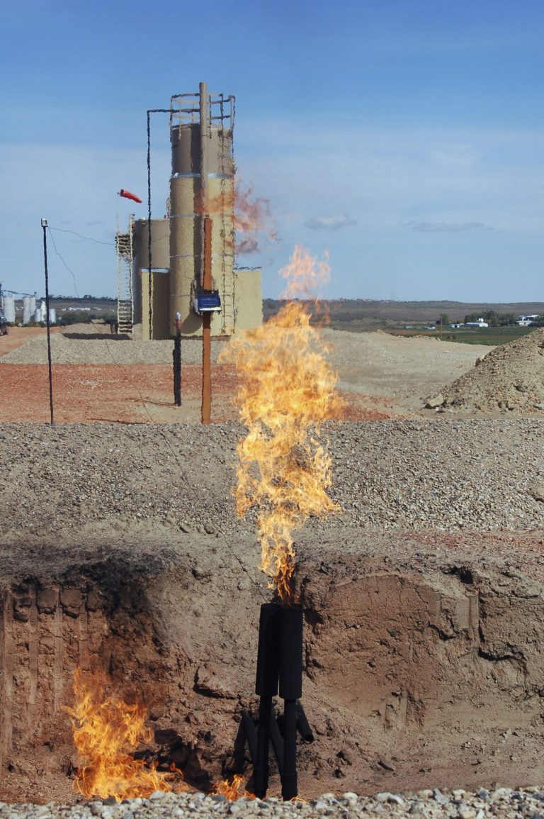FILE - In this Sept. 23, 2008 file photo, natural gas is flared from an oil well near Parshall, N.D. North Dakota oil companies must submit a gas capturing plan with drilling permit applications beginning Monday, June 2, 2014. The state Industrial Commission, which regulates North Dakota's oil and gas industry, unanimously endorsed the proposal in March in an attempt to cut down the amount of natural gas that is burned off and wasted as a byproduct of oil production. (AP Photo/James MacPherson, File)